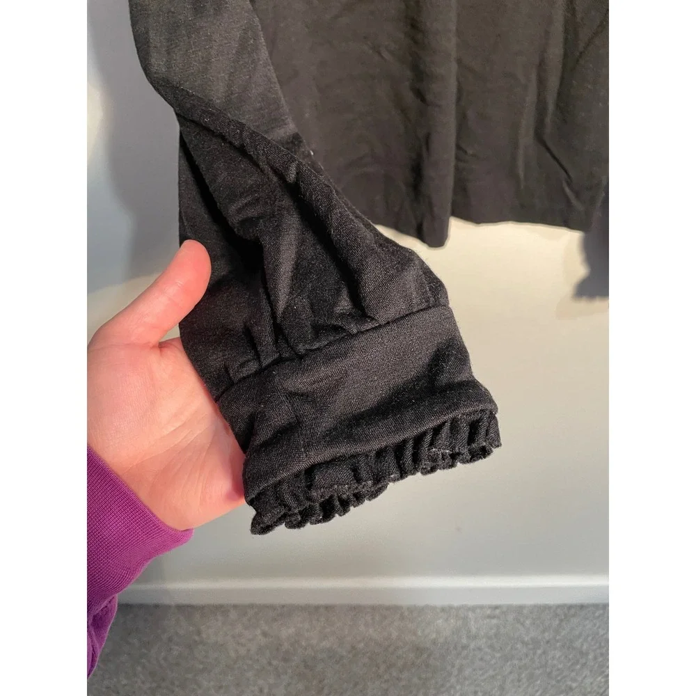 Diane von Furstenberg Black Wool Turtleneck‎ Ruffle Hem Top Size 10 Quiet Luxury